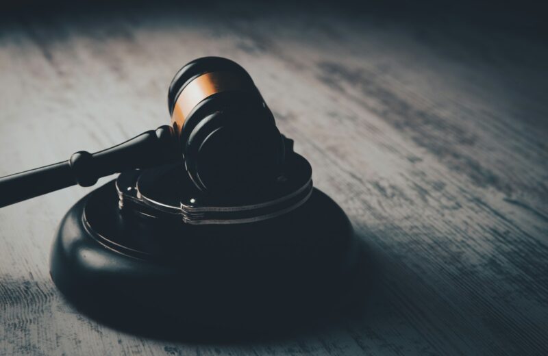 a judge's gaven on a wooden table