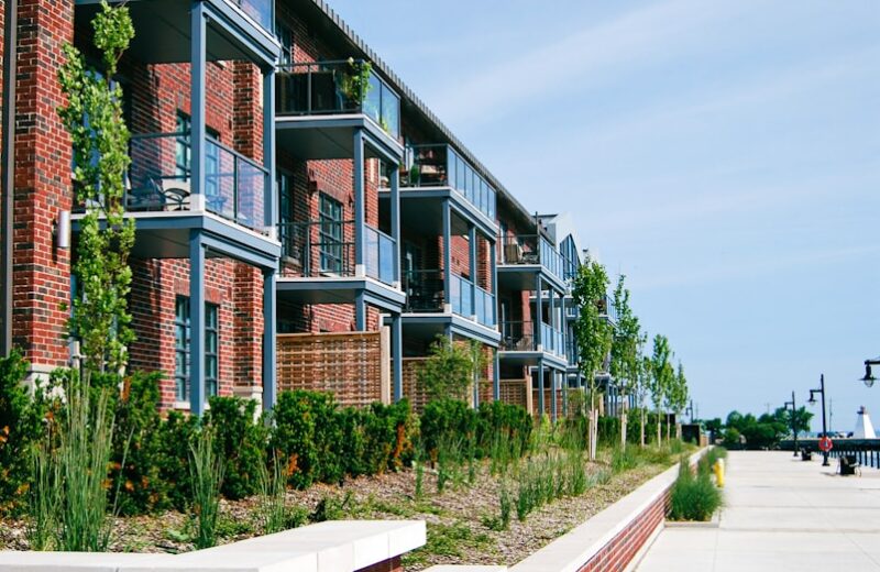 a red brick building with several balconies next to it